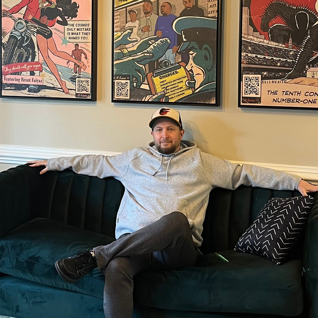 Artist/Owner Michael Kreiser of Fine Art of MK/MK Comics with his artwork behind him