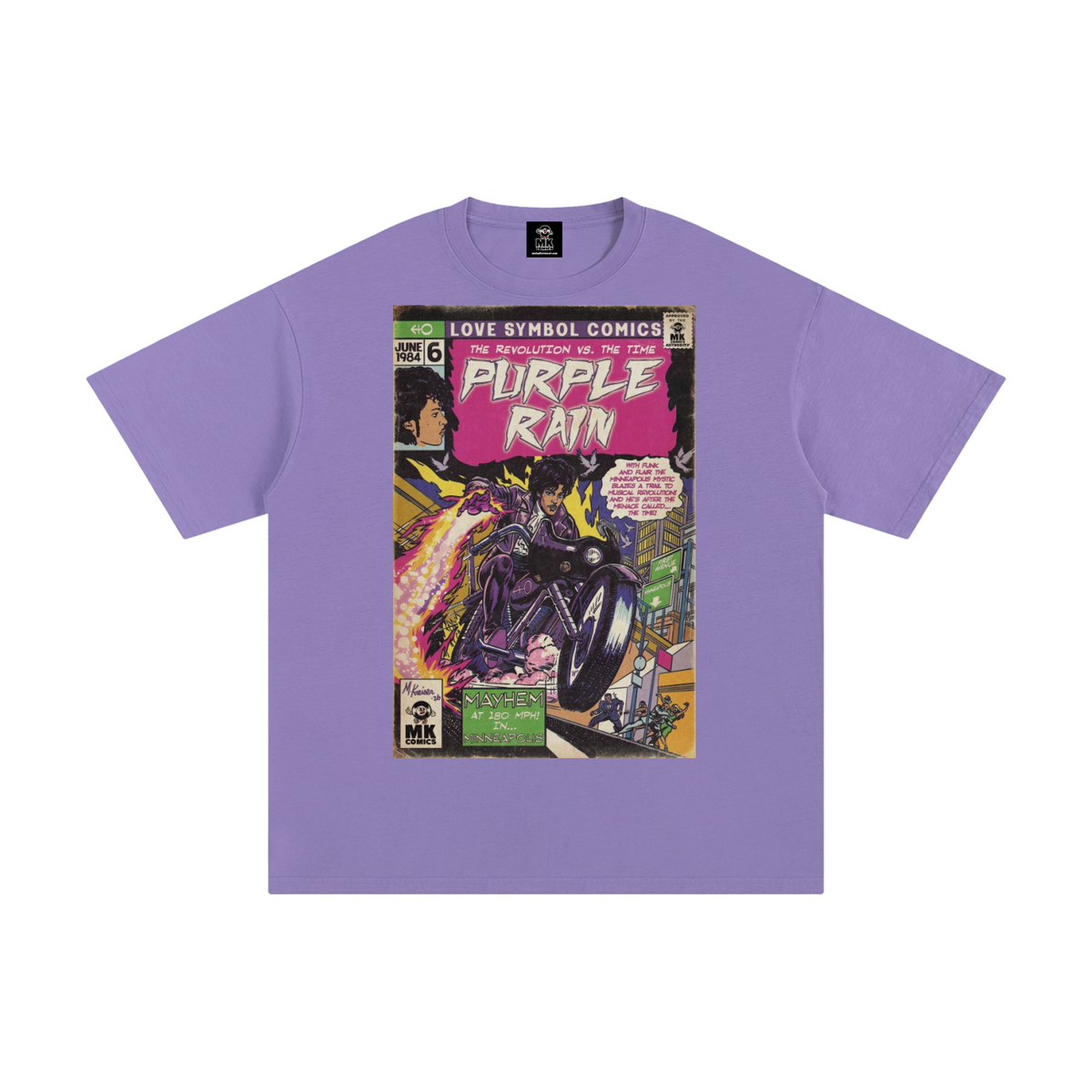A light purple short-sleeve t-shirt with a vintage comic book cover graphic on the front featuring the title Prince 'Purple Rain' and 'Love Symbol Comics'.
