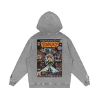 A gray mineral-wash hoodie shown from the back, featuring a large vintage comic book cover graphic by MK Comics Parody Art with the word 'TOMMY' by the Who in bold yellow letters and various illustrated characters.